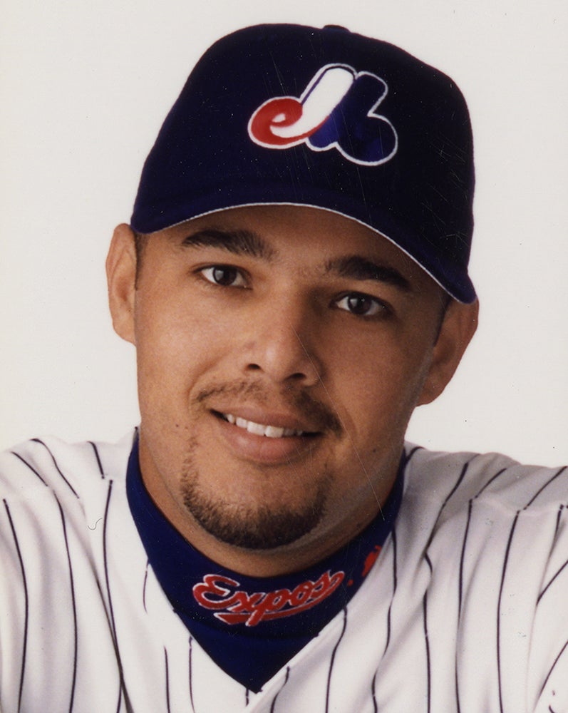 Head and shoulders portrait of Javier Vázquez wearing Expos uniform